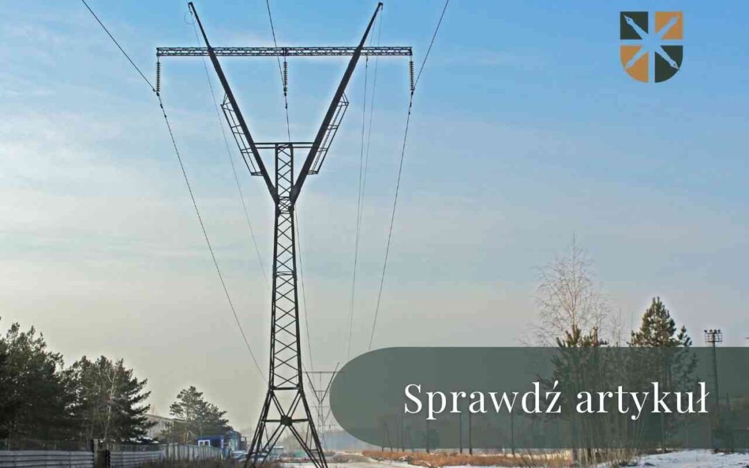 Wielki słup energetyczny w kształcie litery V przy zaśnieżonej drodze – grafika z napisem Sprawdź artykuł.
