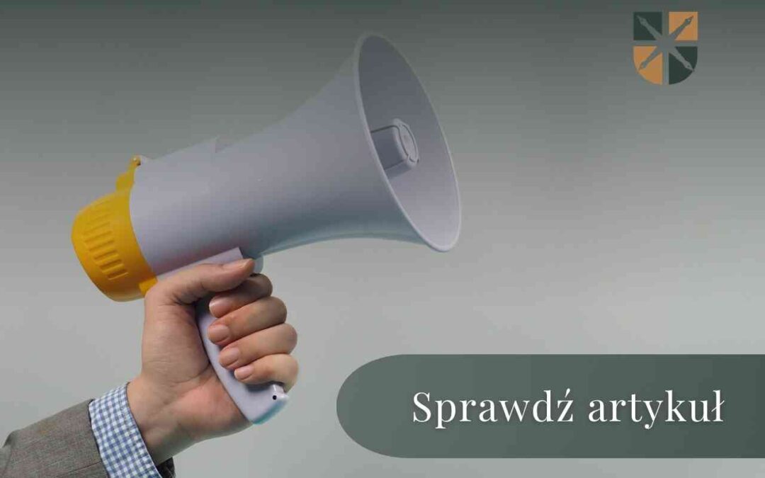 Ręka trzyma tubę nagłośnieniową z napisem "Sprawdź artykuł" o ochronie prawnej przed hałasem.