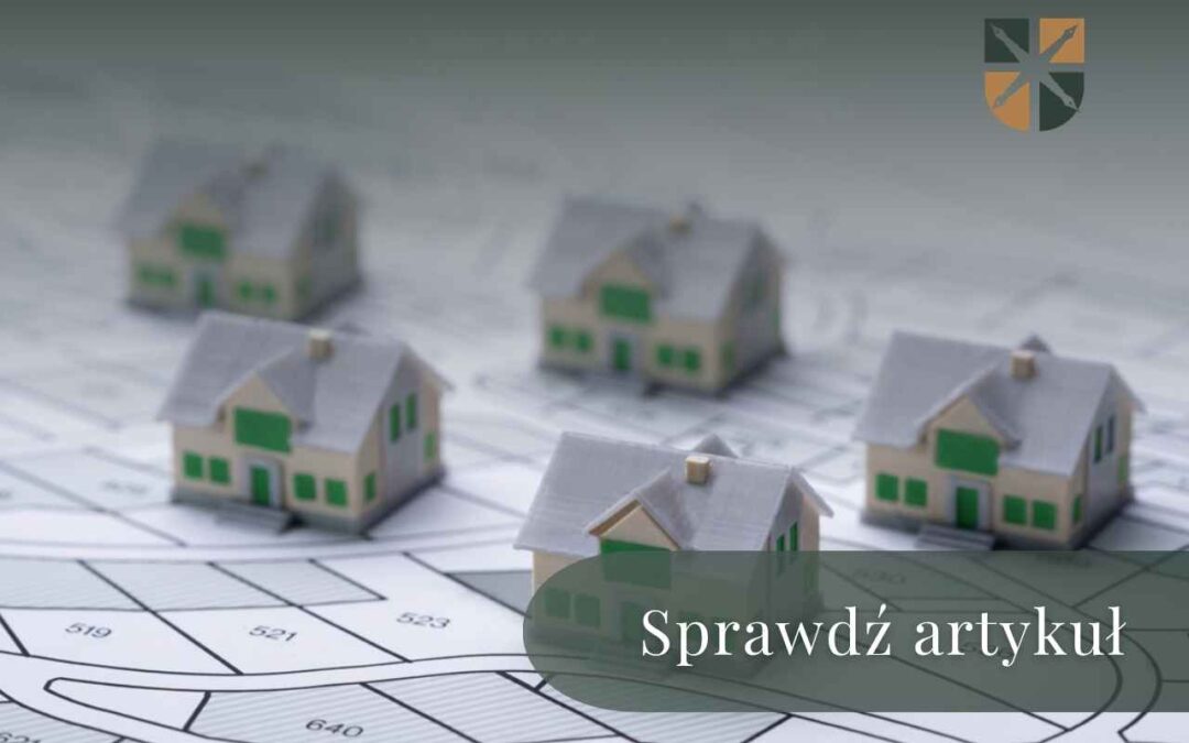 Modele domów jednorodzinnych stojące na mapie podziału geodezyjnego działek.